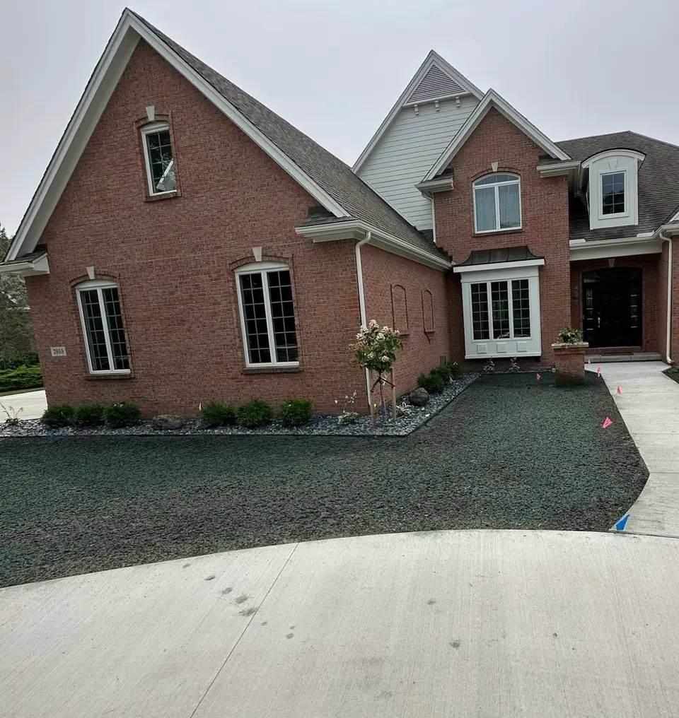 Brick home with fresh landscape beds and new lawn